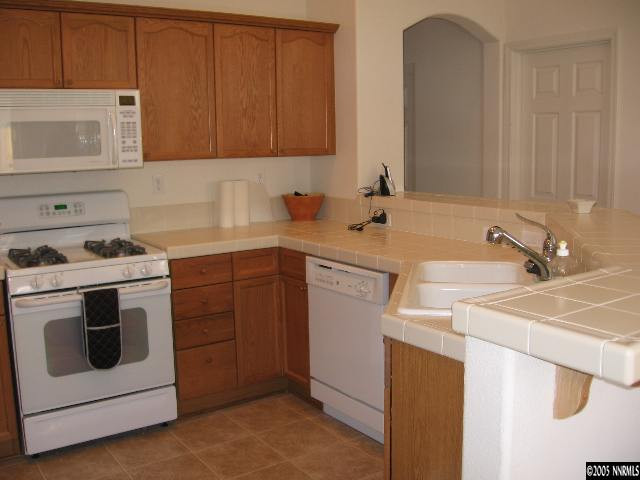 1753 Camaraderie Way Reno, NV 89521 - Photo 3 of 8 a utility room with sink dryer and washer