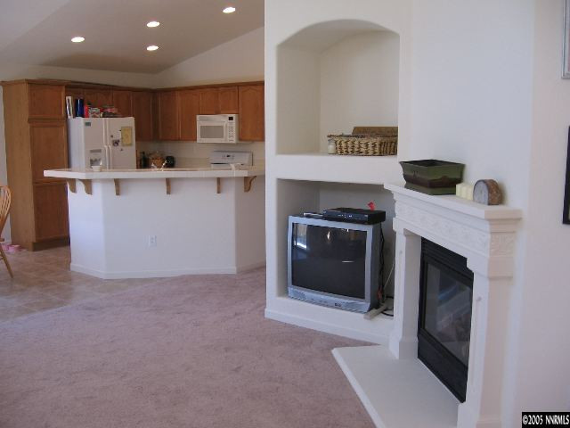 1753 Camaraderie Way Reno, NV 89521 - Photo 5 of 8 a kitchen with a stove and a refrigerator