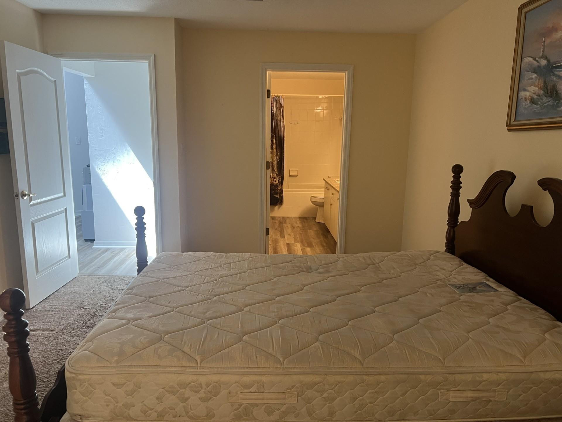 539 Lake Bridge Drive Ormond Beach, FL 32174 - Photo 12 of 34 a bedroom with a bed and a large mirror