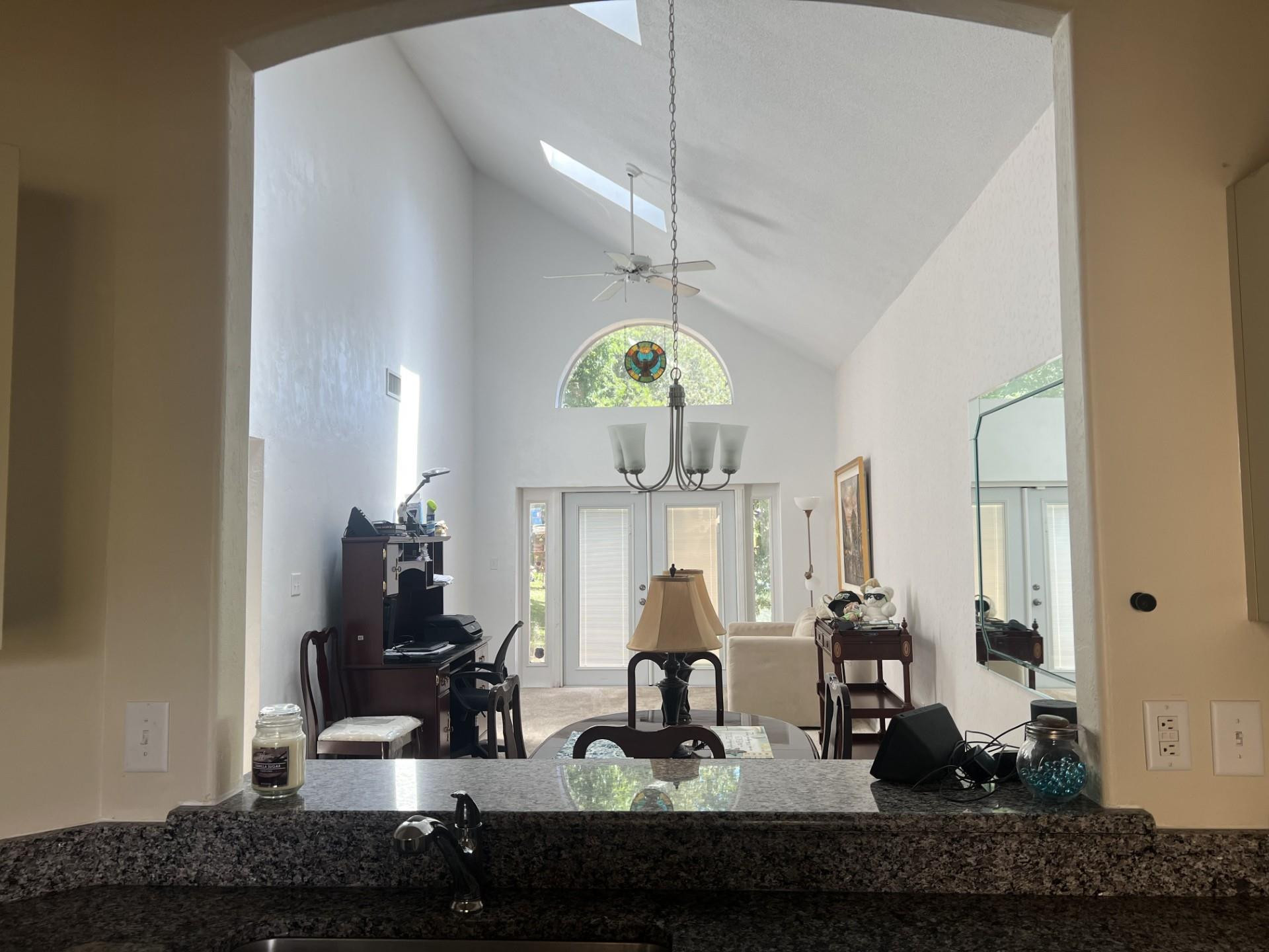 539 Lake Bridge Drive Ormond Beach, FL 32174 - Photo 16 of 34 a view of living room with furniture and a chandelier