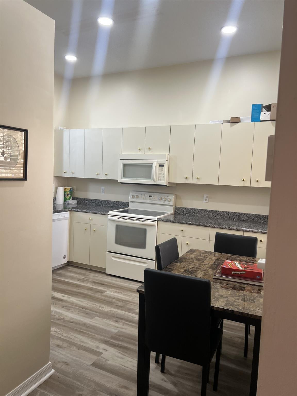 539 Lake Bridge Drive Ormond Beach, FL 32174 - Photo 17 of 34 a kitchen with a sink cabinets and wooden floor