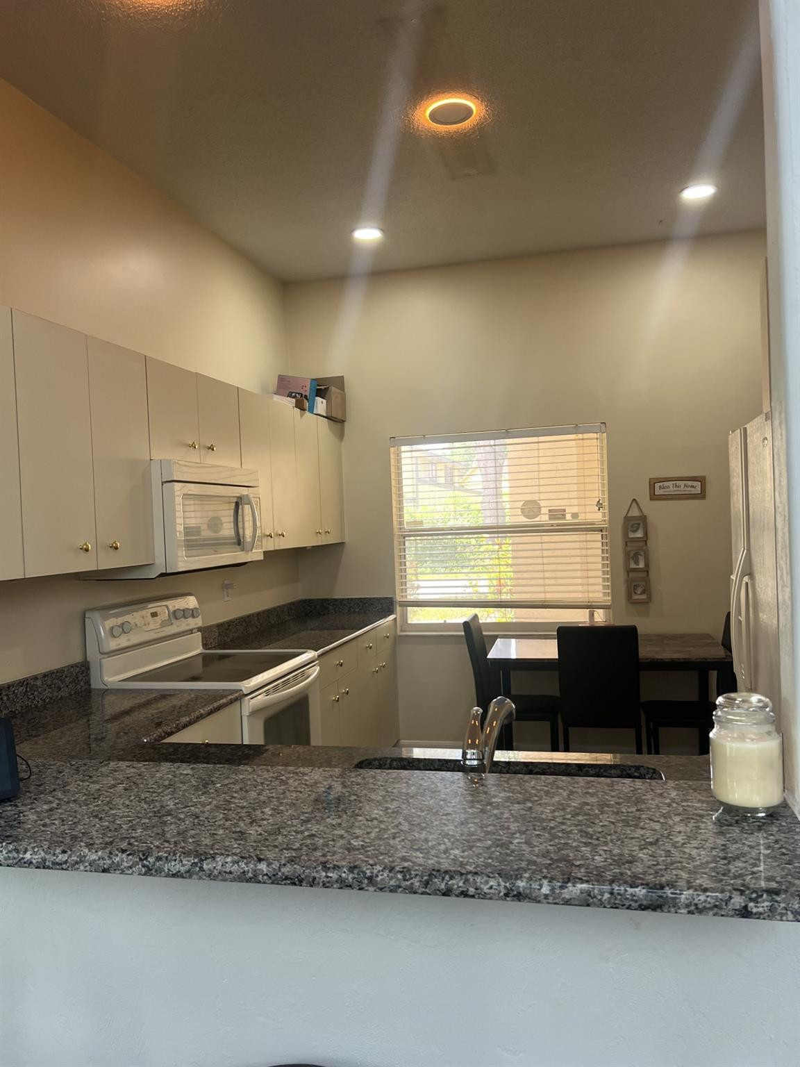 539 Lake Bridge Drive Ormond Beach, FL 32174 - Photo 18 of 34 a large bathroom with a granite countertop sink and a mirror