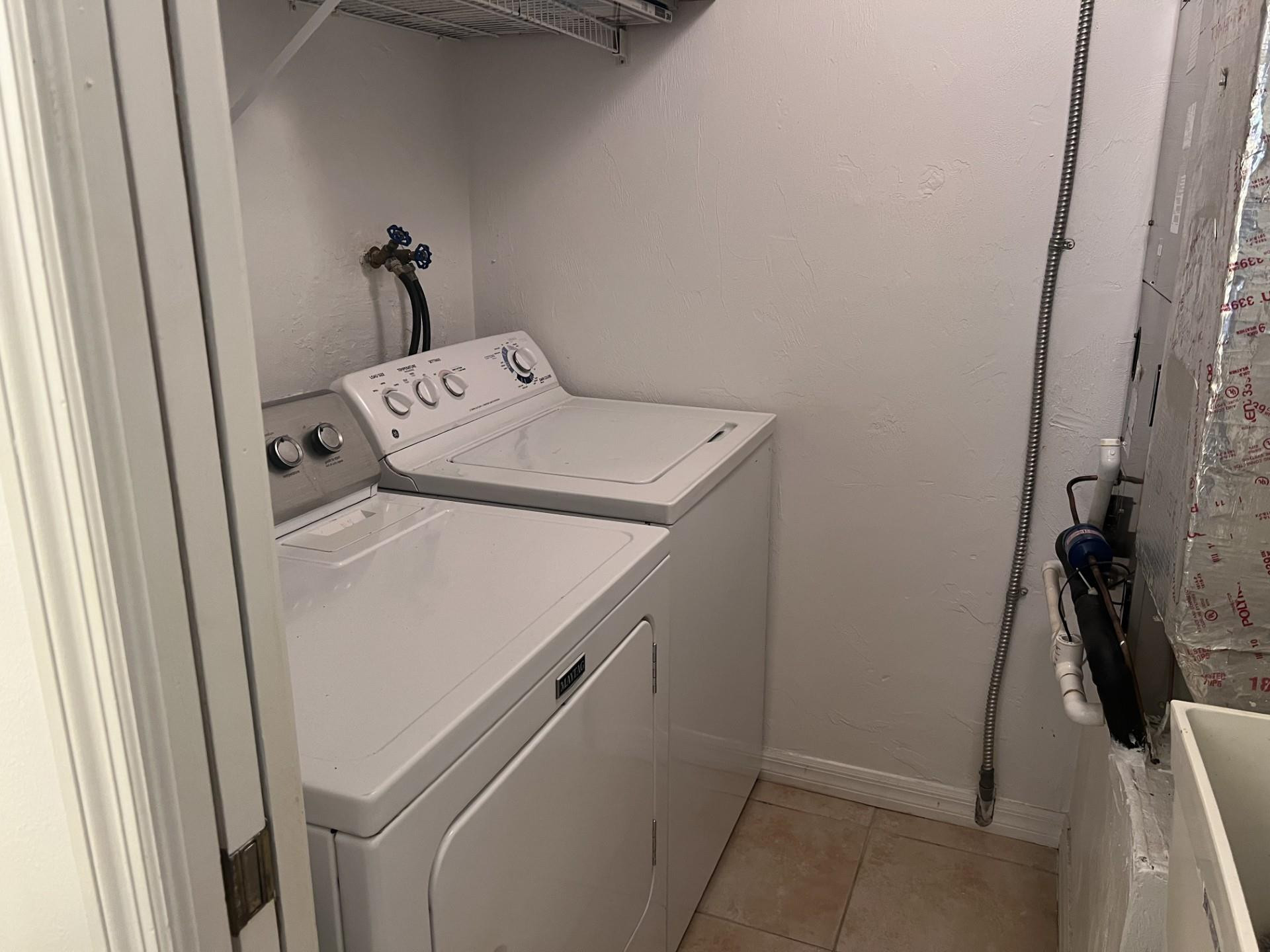 539 Lake Bridge Drive Ormond Beach, FL 32174 - Photo 19 of 34 a utility room with dryer and washer