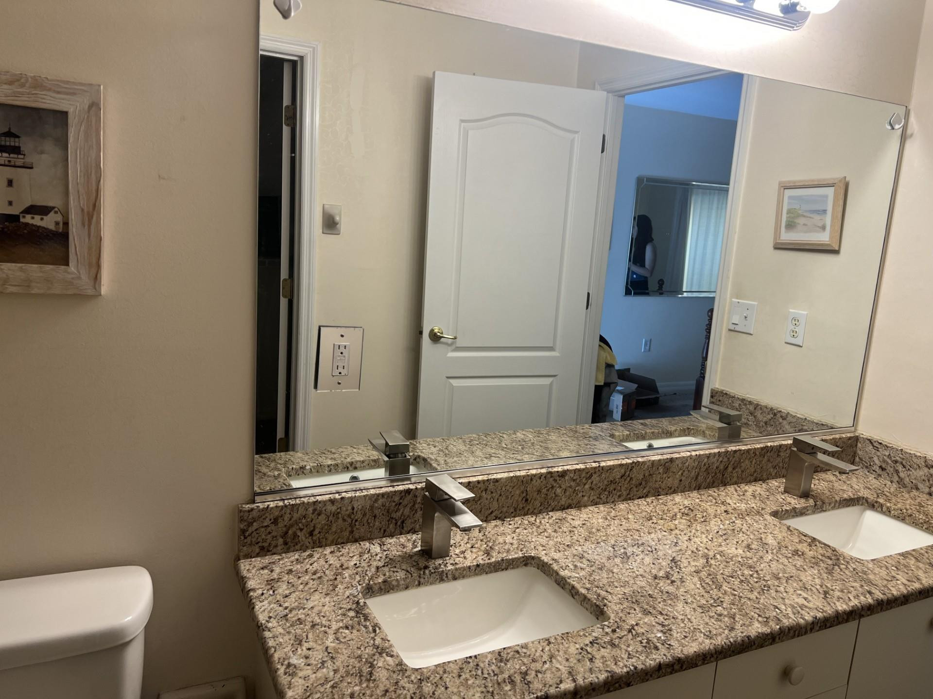 539 Lake Bridge Drive Ormond Beach, FL 32174 - Photo 9 of 34 a bathroom with a granite countertop sink and a mirror