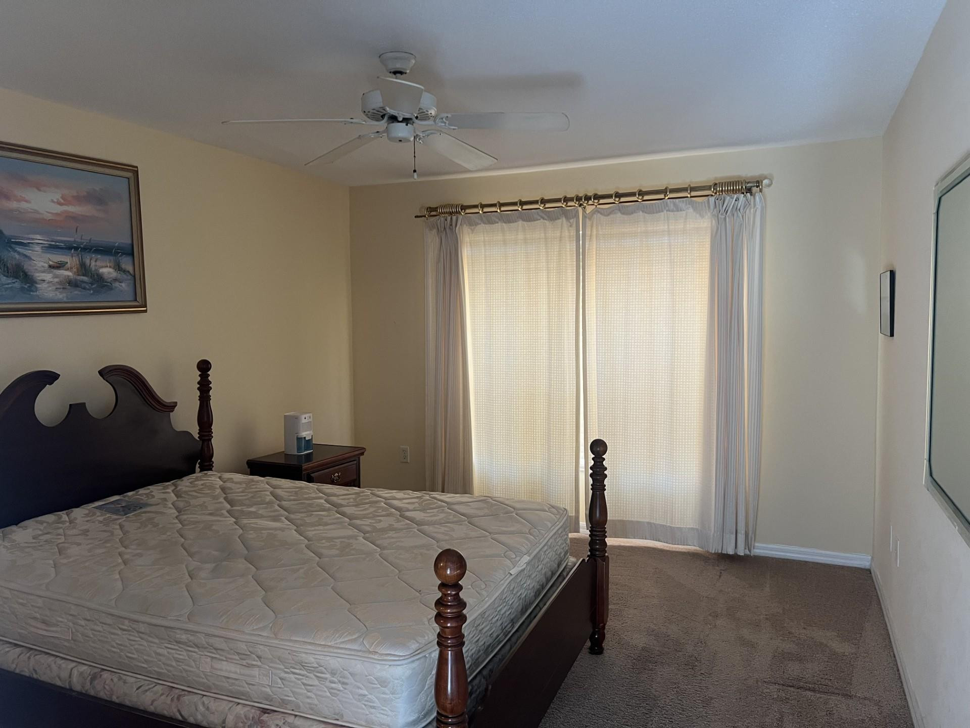 539 Lake Bridge Drive Ormond Beach, FL 32174 - Photo 10 of 34 a bedroom with a bed and a painting on the wall