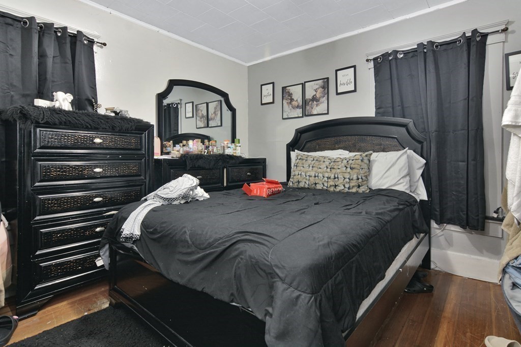 210 Ferry Street Lawrence, MA 01841 - Photo 13 of 24 a bedroom with a bed and closet