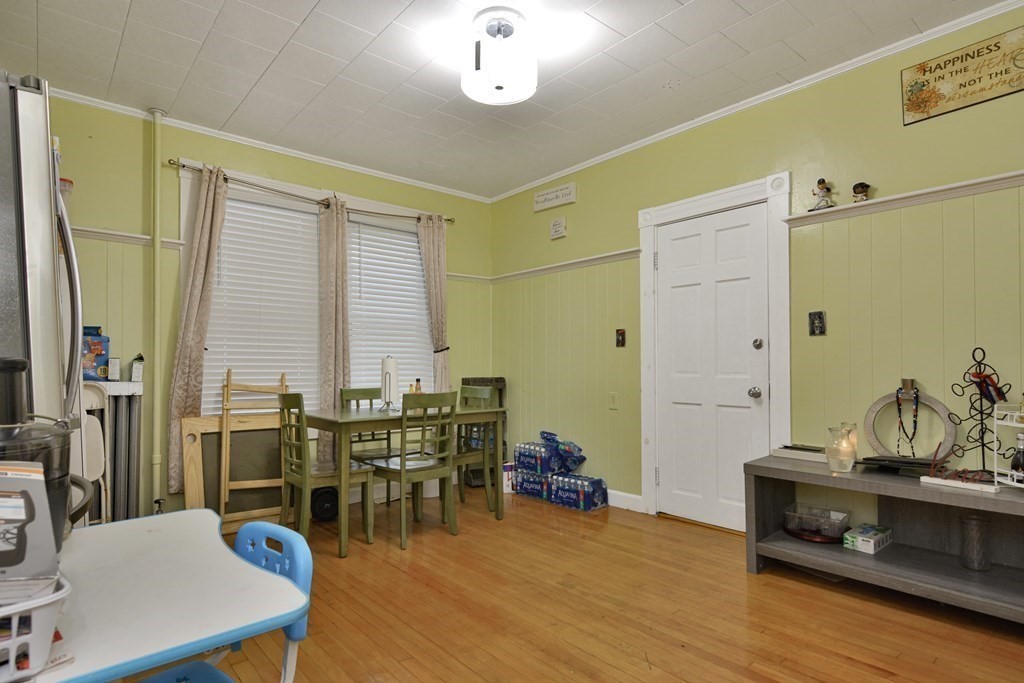 210 Ferry Street Lawrence, MA 01841 - Photo 17 of 24 a view of a dining room with furniture and wooden floor