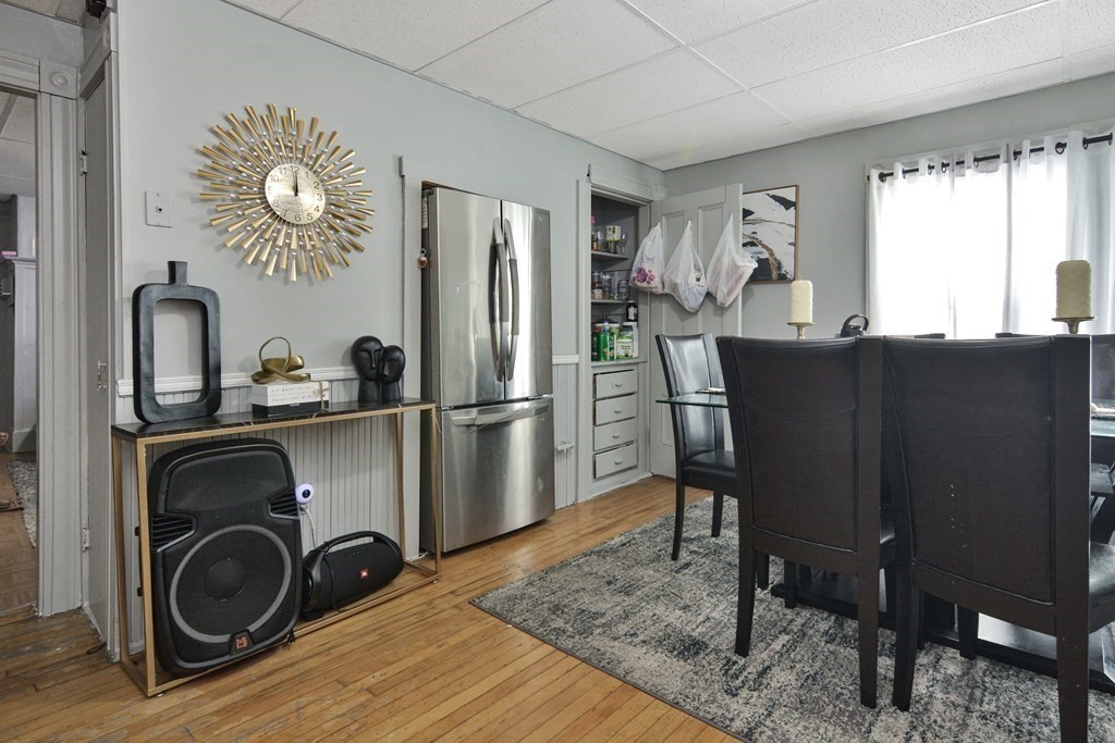 210 Ferry Street Lawrence, MA 01841 - Photo 4 of 24 a kitchen with cabinets and stainless steel appliances