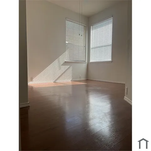 a view of a livingroom with wooden floor