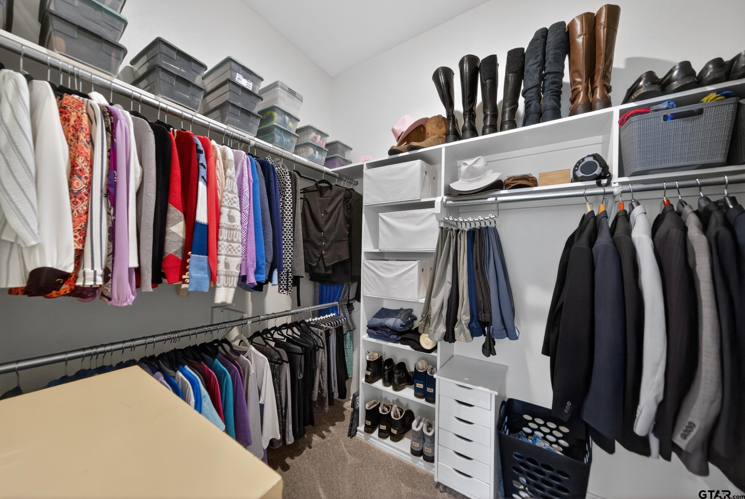 7836 Freestone Drive Bullard, TX 75757 - Photo 13 of 43 a view of walk in closet with clothes and shoes
