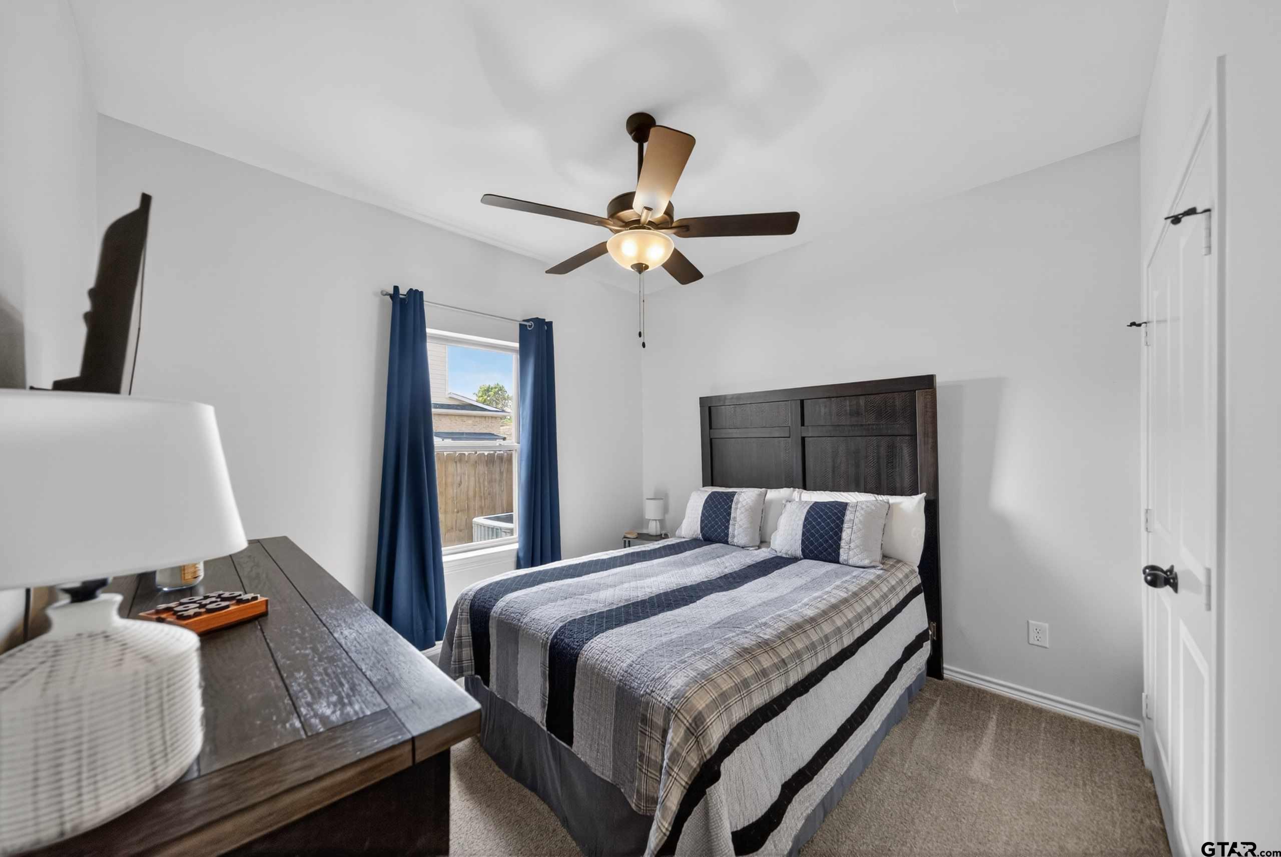 7836 Freestone Drive Bullard, TX 75757 - Photo 20 of 43 a bedroom with a bed and a desk