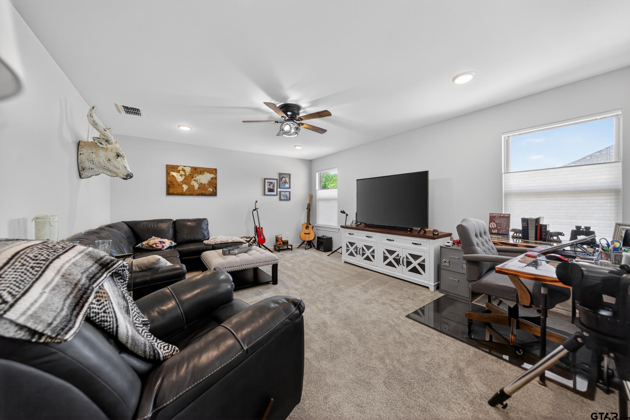 7836 Freestone Drive Bullard, TX 75757 - Photo 26 of 43 a living room with furniture and a flat screen tv