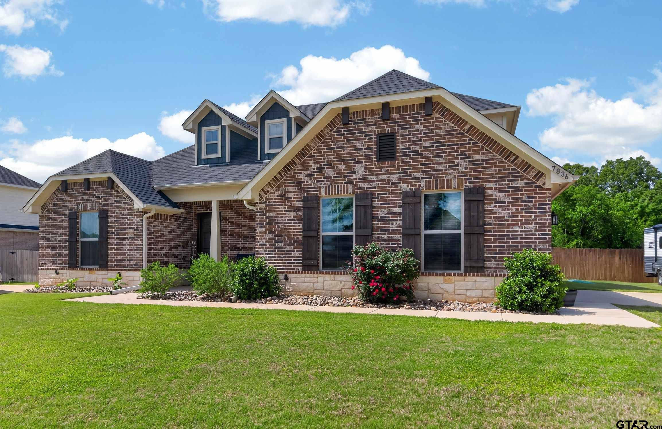 7836 Freestone Drive Bullard, TX 75757 - Photo 43 of 43 a front view of a house with a garden and plants