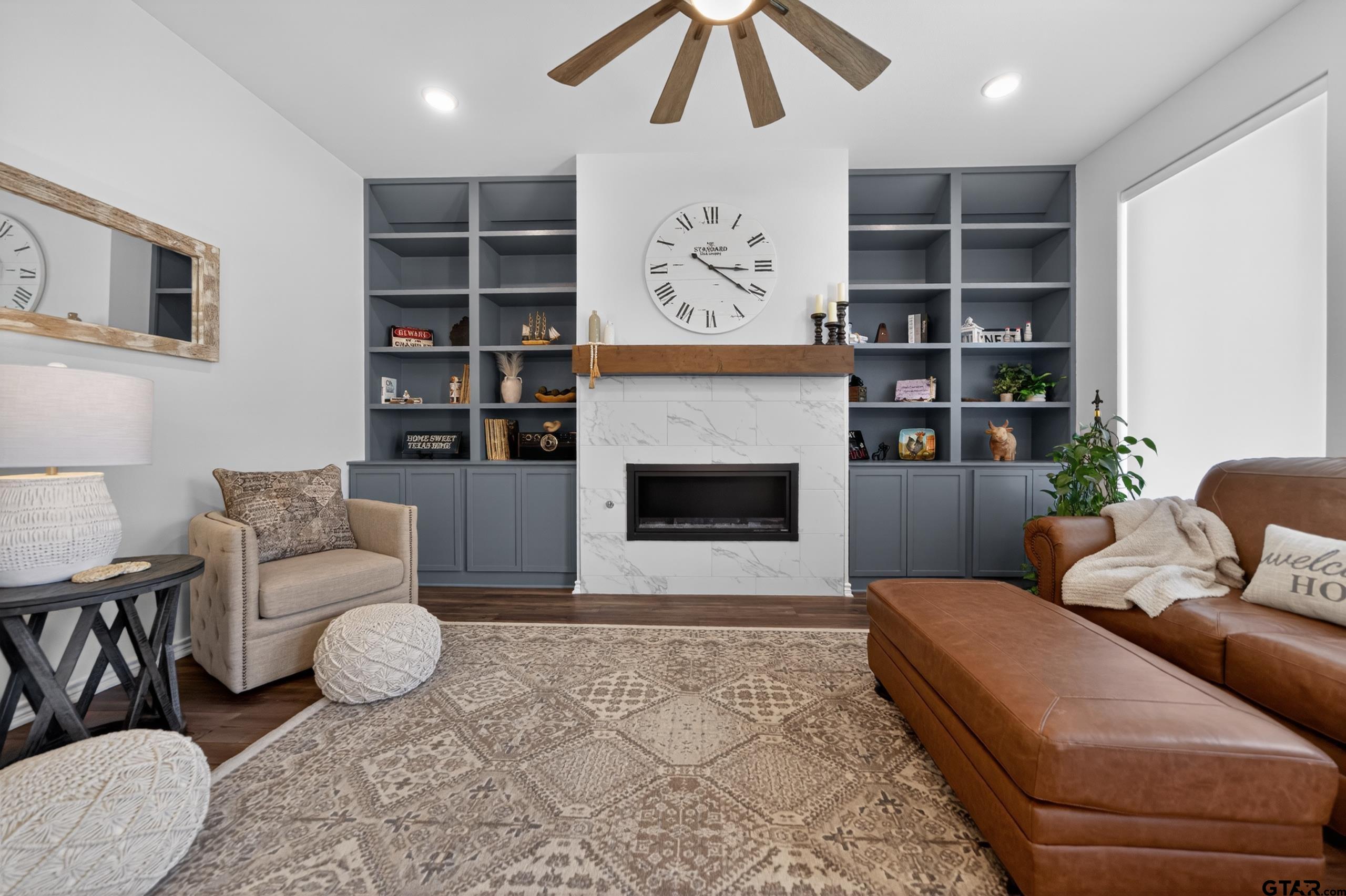 7836 Freestone Drive Bullard, TX 75757 - Photo 10 of 43 a living room with furniture and a fireplace