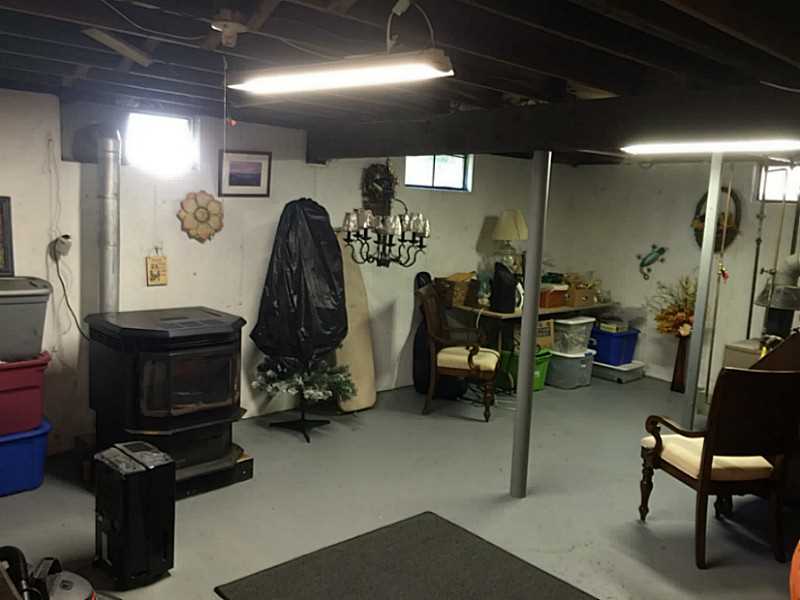 59 Bradford Road Westerly, RI 02808 - Photo 19 of 25 Cellar or Basement. With pellet stove