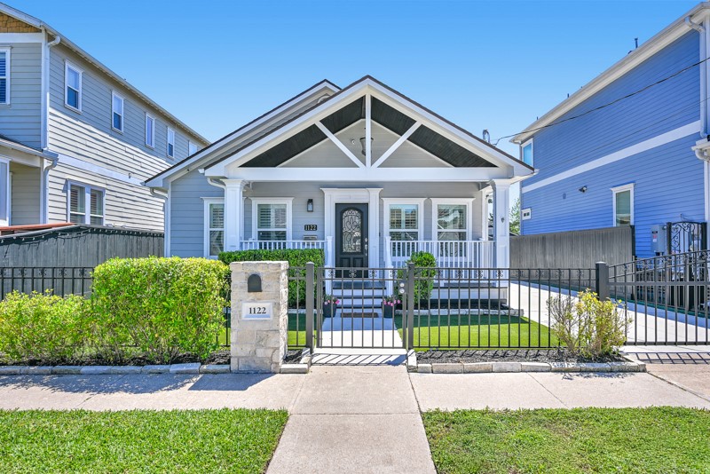 1122 East 23rd Street Houston, TX 77009 - Photo 1 of 23 Charming yet modern home in the heart of Sunset Heights featuring inviting curb appeal, manicured landscaping, a welcoming front porch and a pool.