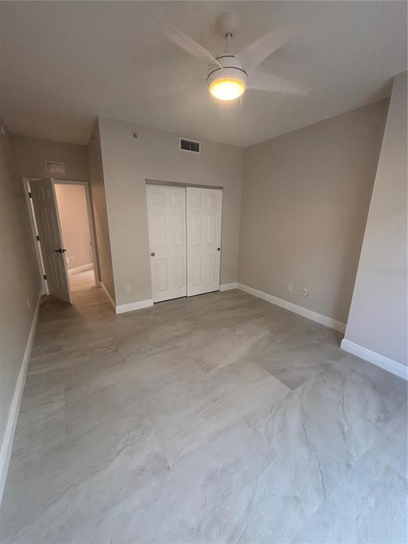 6536 Moorings Point Circle, Unit 101 Lakewood Ranch, FL 34202 - Photo 11 of 34 an empty room with a natural light