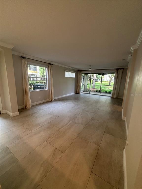 6536 Moorings Point Circle, Unit 101 Lakewood Ranch, FL 34202 - Photo 16 of 34 an empty room with windows