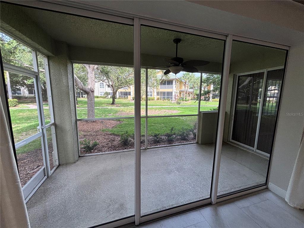 6536 Moorings Point Circle, Unit 101 Lakewood Ranch, FL 34202 - Photo 18 of 34 a view of a room with wooden floor and a large window