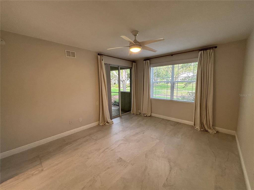 6536 Moorings Point Circle, Unit 101 Lakewood Ranch, FL 34202 - Photo 21 of 34 an empty room with windows
