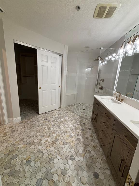 6536 Moorings Point Circle, Unit 101 Lakewood Ranch, FL 34202 - Photo 25 of 34 a bathroom with a sink a vanity and a mirror
