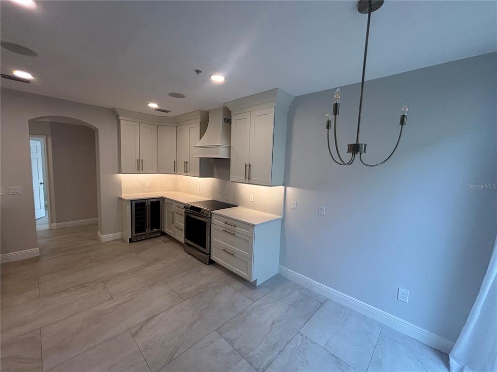 6536 Moorings Point Circle, Unit 101 Lakewood Ranch, FL 34202 - Photo 5 of 34 a large room with cabinets