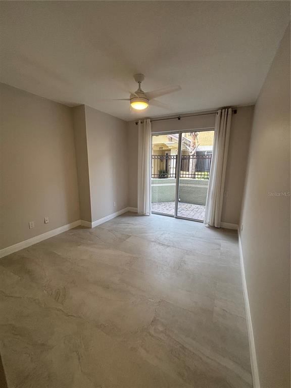 6536 Moorings Point Circle, Unit 101 Lakewood Ranch, FL 34202 - Photo 10 of 34 a view of a room with large windows