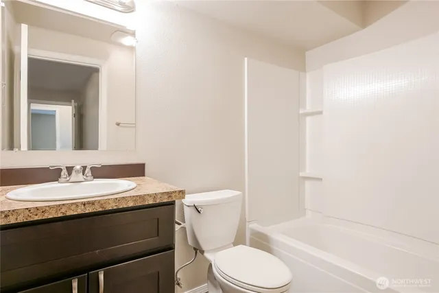 a bathroom with a sink a toilet and a bathtub