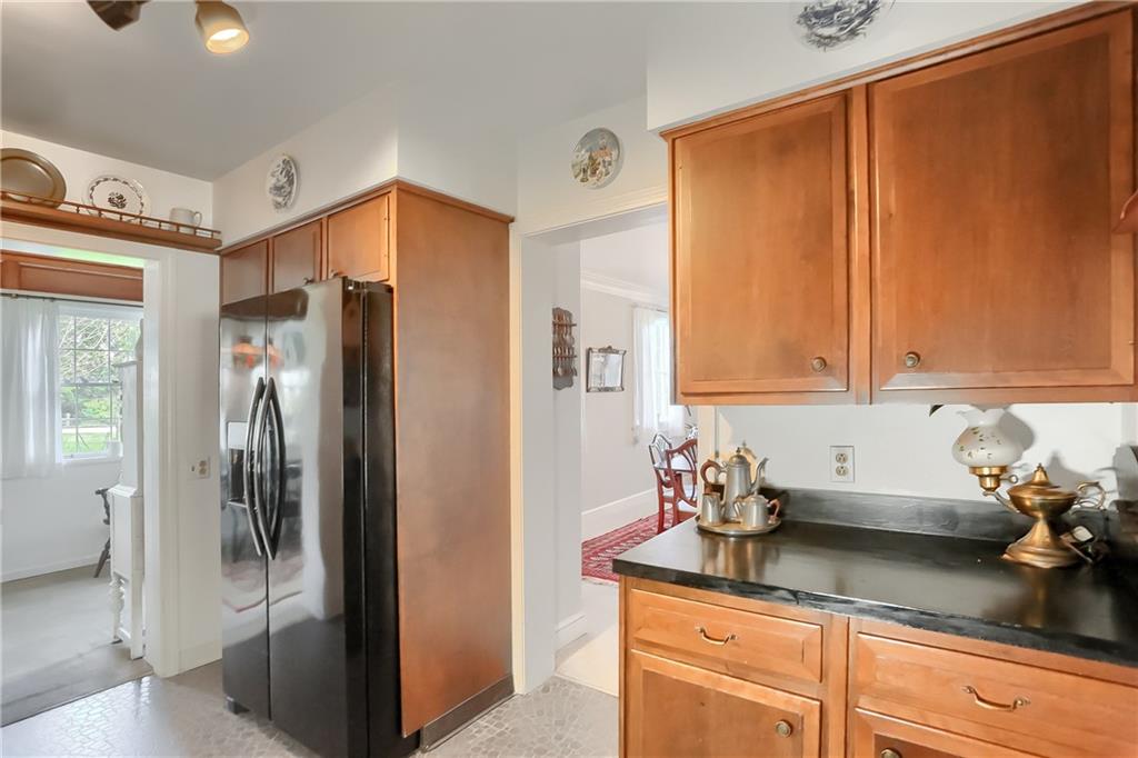 2766 Beaver Grade Road Coraopolis, PA 15108 - Photo 12 of 41 a kitchen with stainless steel appliances granite countertop a refrigerator and a white cabinets