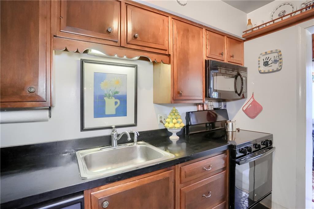 2766 Beaver Grade Road Coraopolis, PA 15108 - Photo 13 of 41 a kitchen with stainless steel appliances granite countertop a sink stove and cabinets