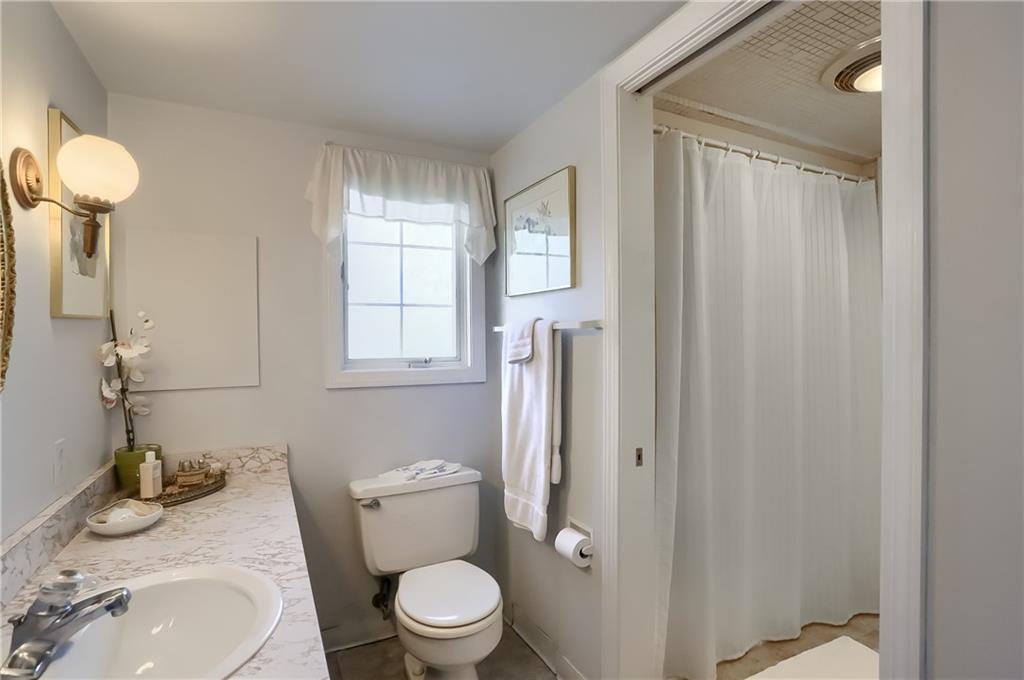 2766 Beaver Grade Road Coraopolis, PA 15108 - Photo 20 of 41 a white toilet sitting next to a bathroom sink