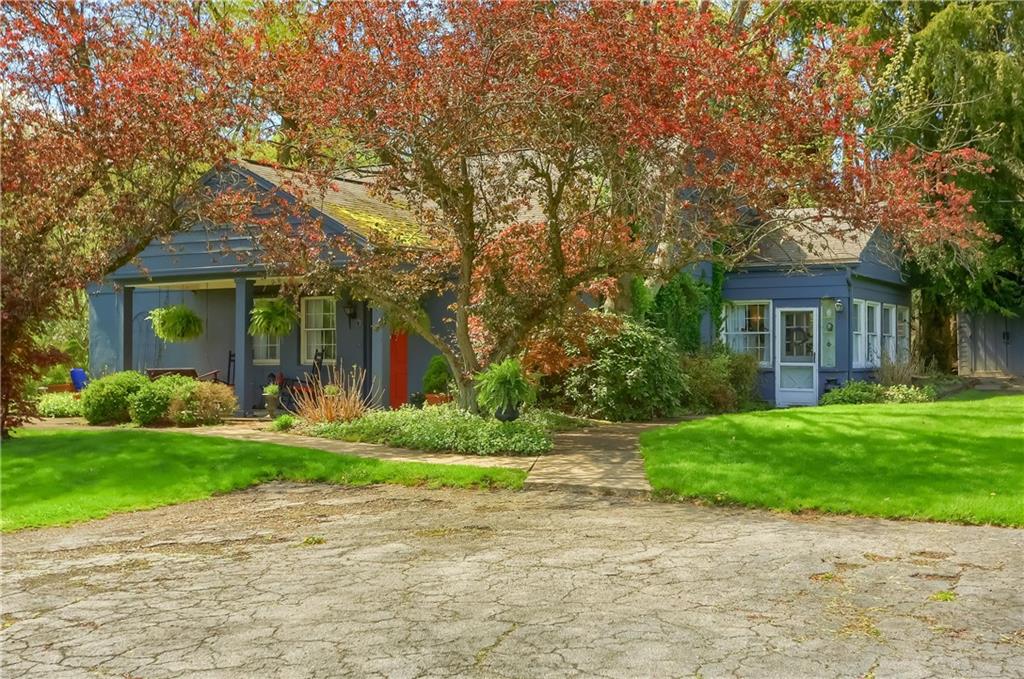 2766 Beaver Grade Road Coraopolis, PA 15108 - Photo 32 of 41 a front view of a house with a yard and garage