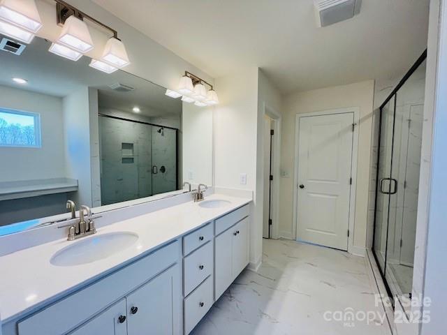 2019 Puddle Pond Road Indian Trail, NC 28079 - Photo 6 of 11 a spacious bathroom with a double vanity sink mirror double and shower