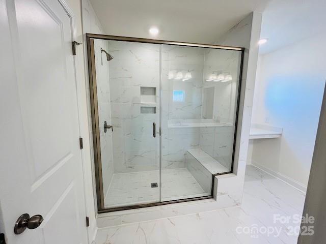 2019 Puddle Pond Road Indian Trail, NC 28079 - Photo 7 of 11 a bathroom with a glass shower door