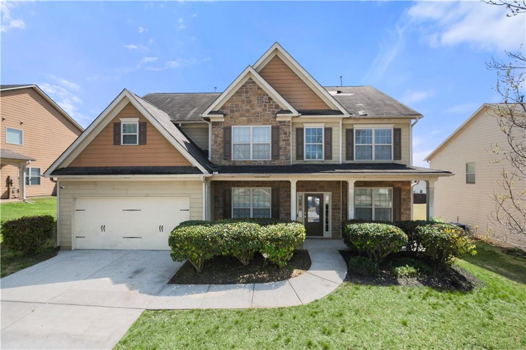 810 Stonehaven Road Southwest Atlanta, GA 30331 - Photo 1 of 1 a front view of a house with a yard