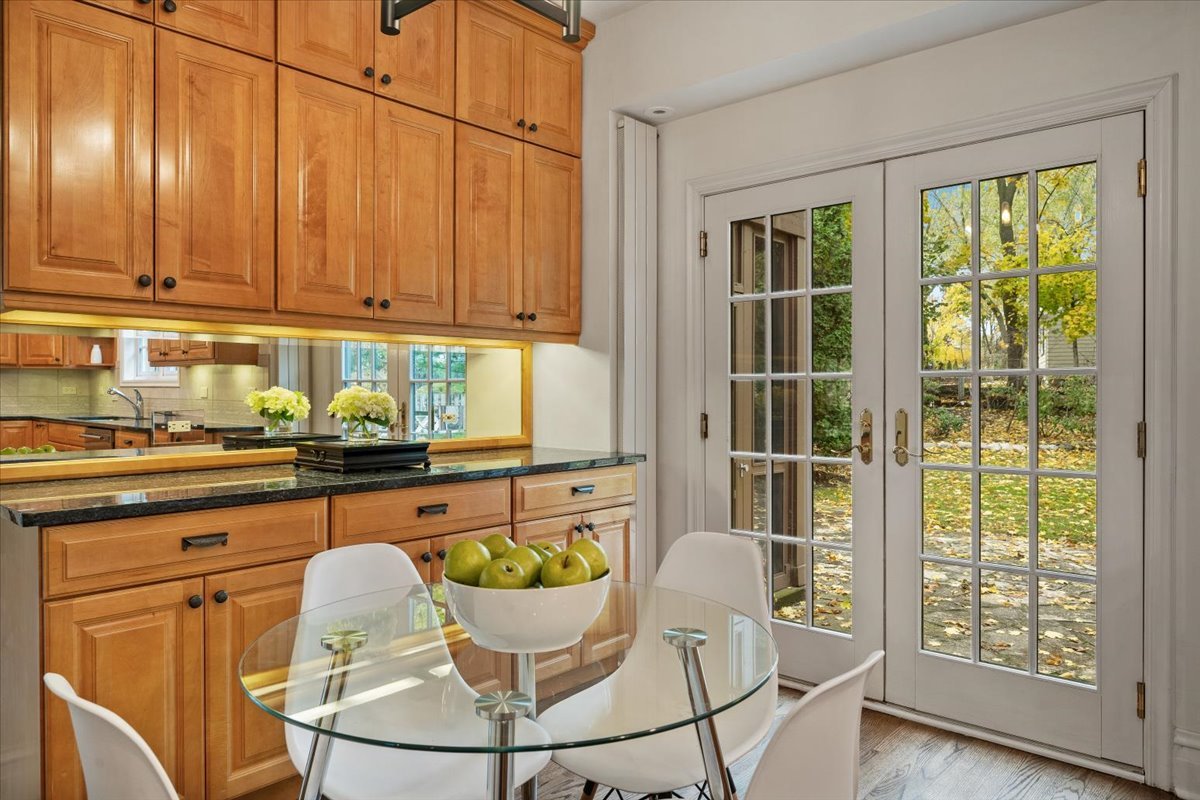 312 Sterling Road Kenilworth, IL 60043 - Photo 18 of 51 a kitchen with a table chairs and wooden floor