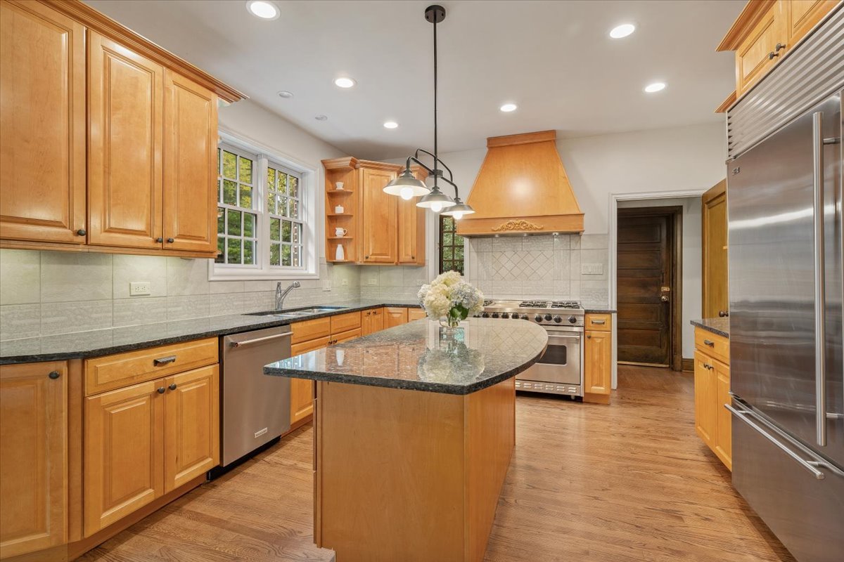 312 Sterling Road Kenilworth, IL 60043 - Photo 19 of 51 a kitchen with a sink stove and cabinets