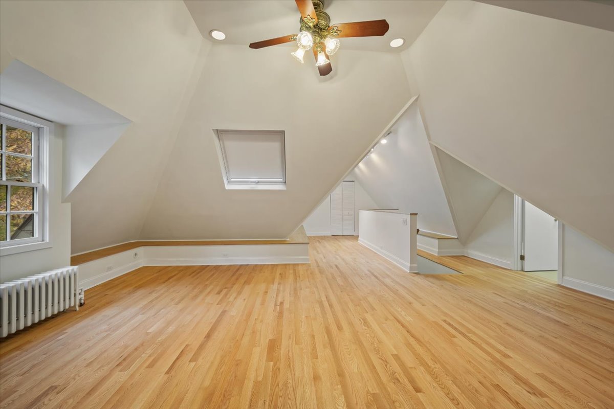 312 Sterling Road Kenilworth, IL 60043 - Photo 41 of 51 wooden floor in an empty room with a window