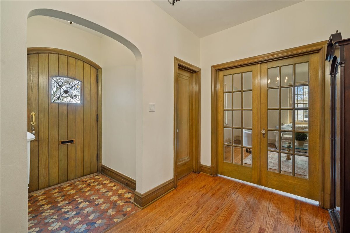 312 Sterling Road Kenilworth, IL 60043 - Photo 5 of 51 a view of an empty room with glass door and a window