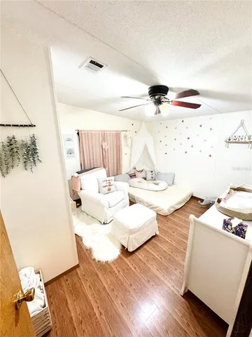 a view of balcony with wooden floor and fence