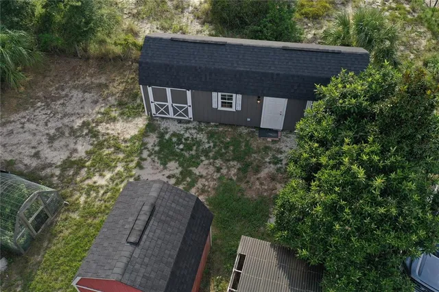 a view of a lake with houses in the back
