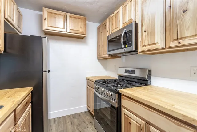 a kitchen with a sink and a window