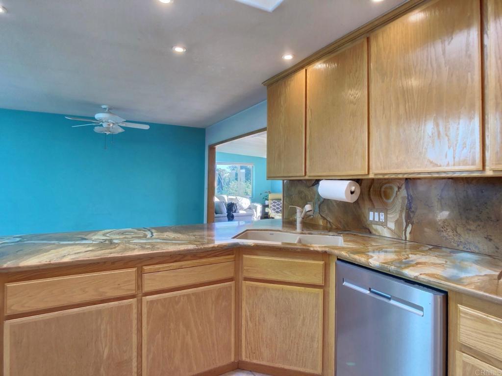 8242 Sunset Road Lakeside, CA 92040 - Photo 11 of 48 a kitchen with a sink cabinets and window