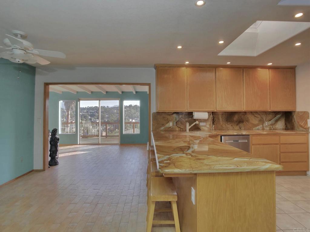 8242 Sunset Road Lakeside, CA 92040 - Photo 12 of 48 a kitchen with a sink and counter top space