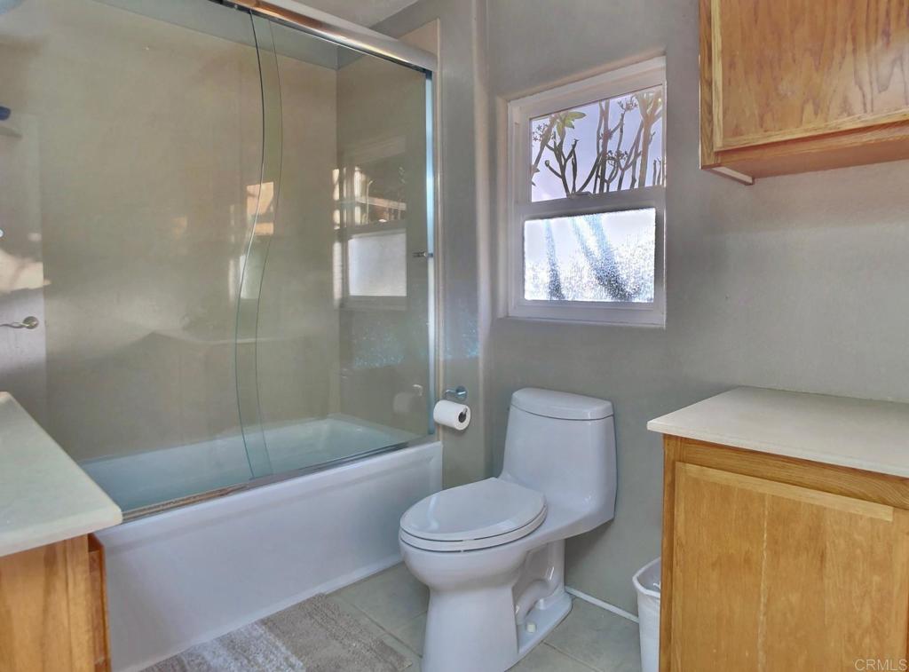 8242 Sunset Road Lakeside, CA 92040 - Photo 20 of 48 a bathroom with a toilet and a shower