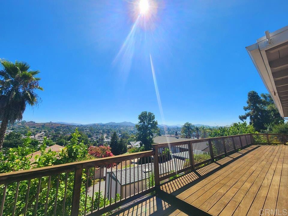 8242 Sunset Road Lakeside, CA 92040 - Photo 2 of 48 a view of a balcony with wooden floor and fence
