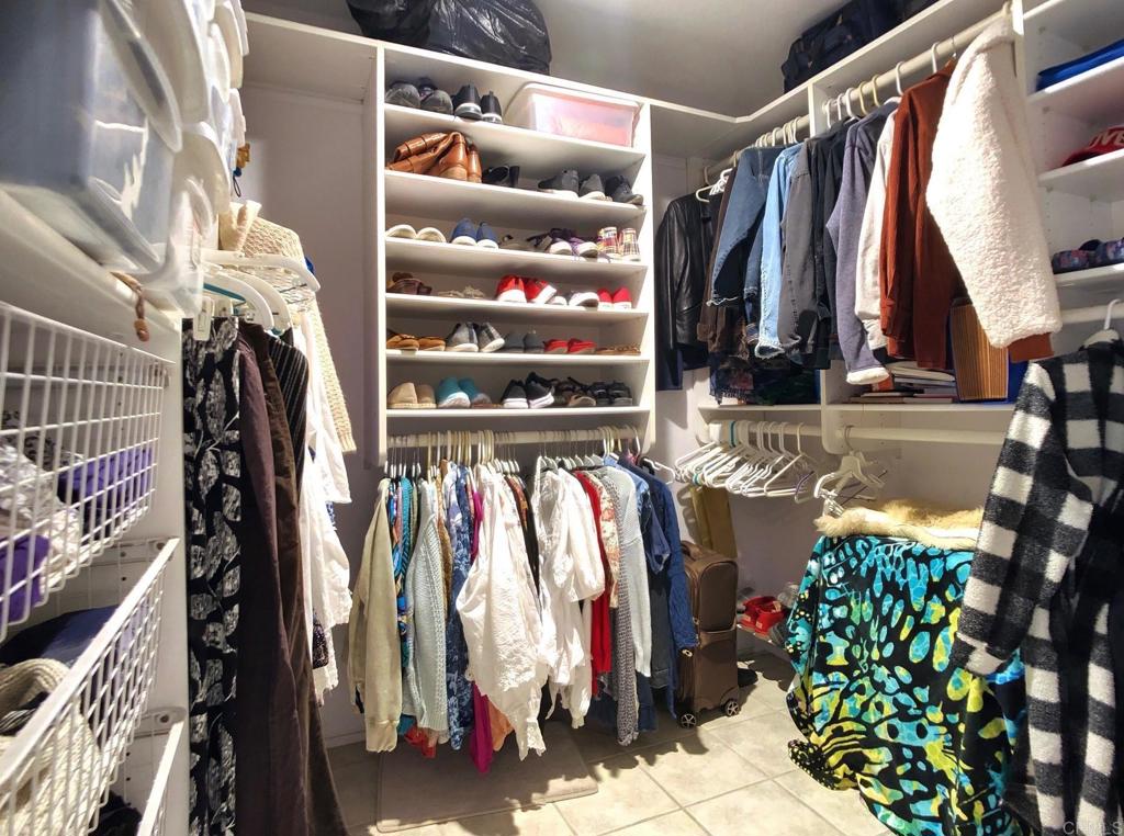 8242 Sunset Road Lakeside, CA 92040 - Photo 26 of 48 a view of walk in closet with clothes and shoes