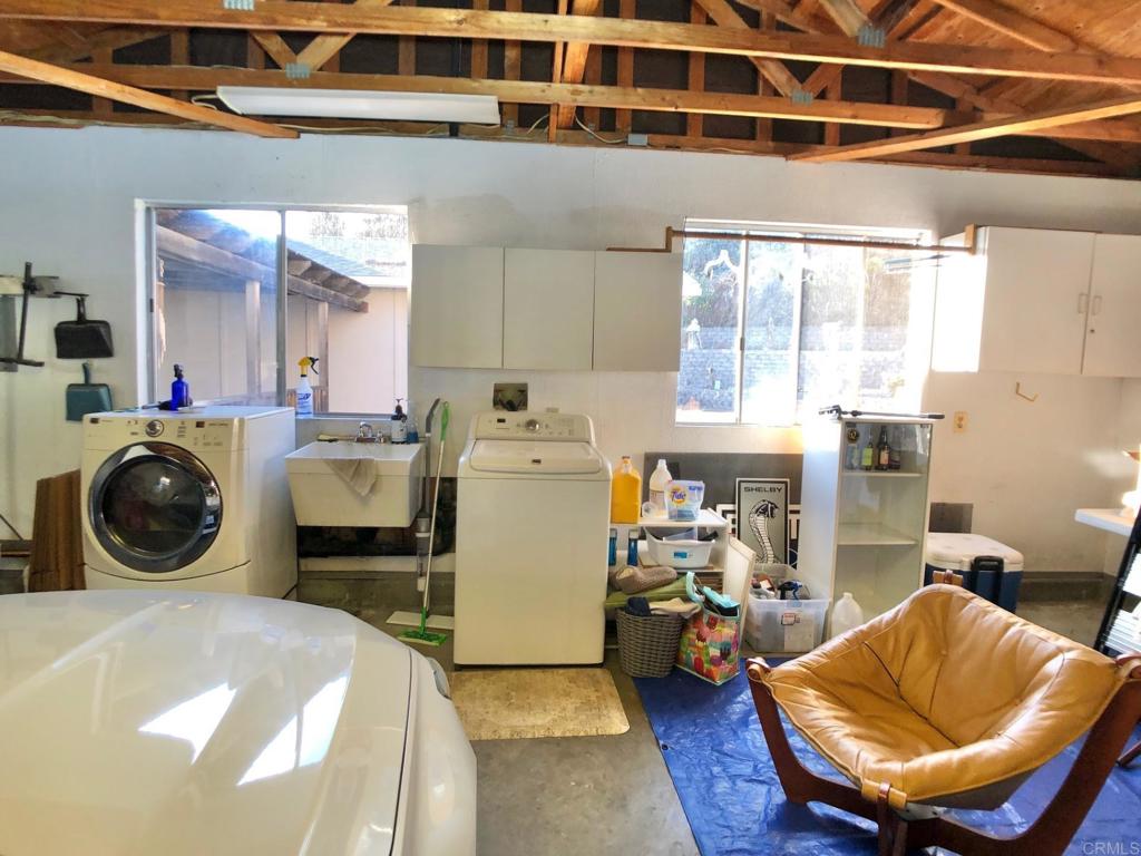 8242 Sunset Road Lakeside, CA 92040 - Photo 28 of 48 a bed room with a bed and a chair