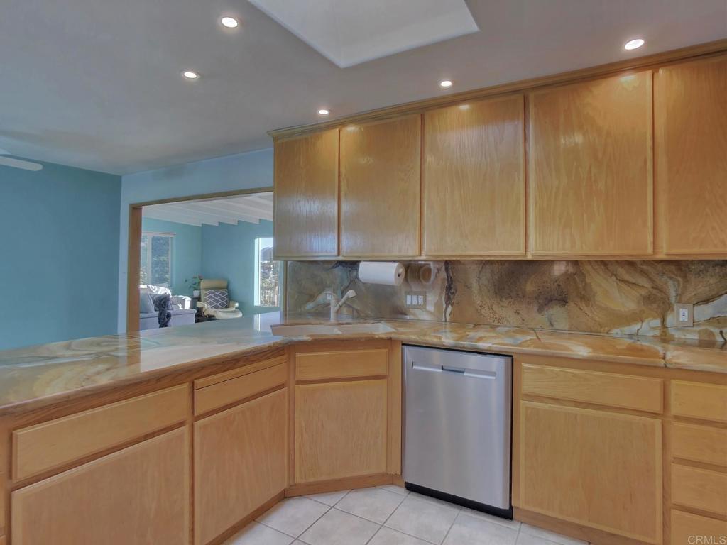 8242 Sunset Road Lakeside, CA 92040 - Photo 10 of 48 a kitchen with white cabinets