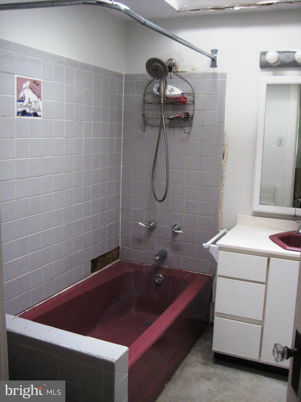 622 Ritchie Avenue Silver Spring, MD 20910 - Photo 14 of 25 a bathroom with a granite countertop sink a toilet and shower